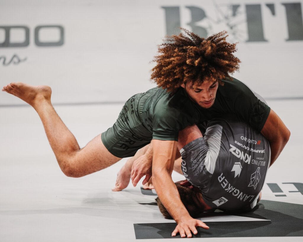 CJI competitors grappling on the mat at an event.