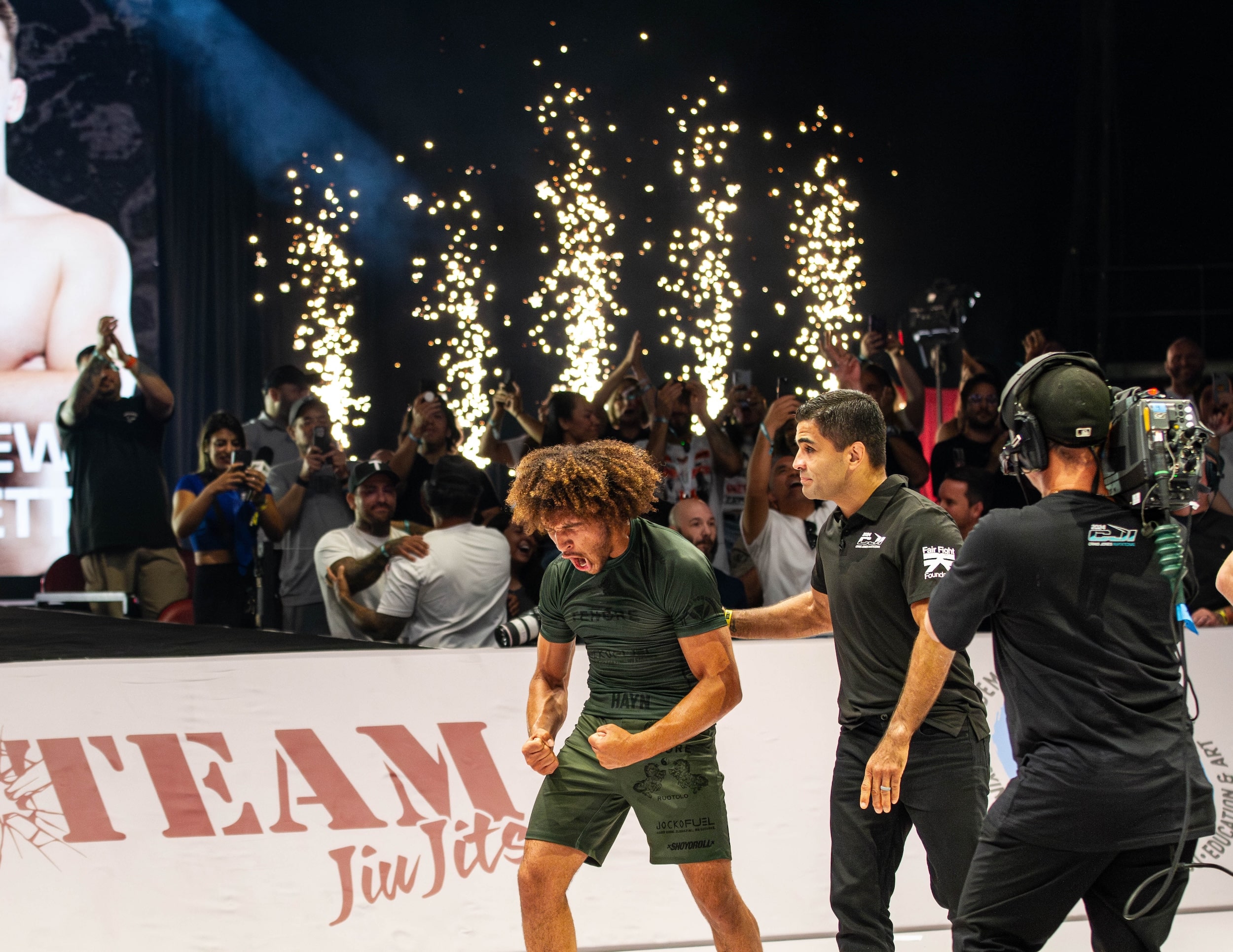 CJI competitor celebrating win on the mat.