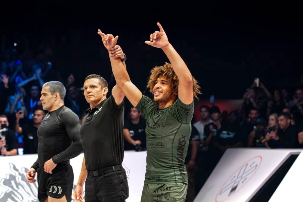 CJI competitors grappling on the mat at an event.