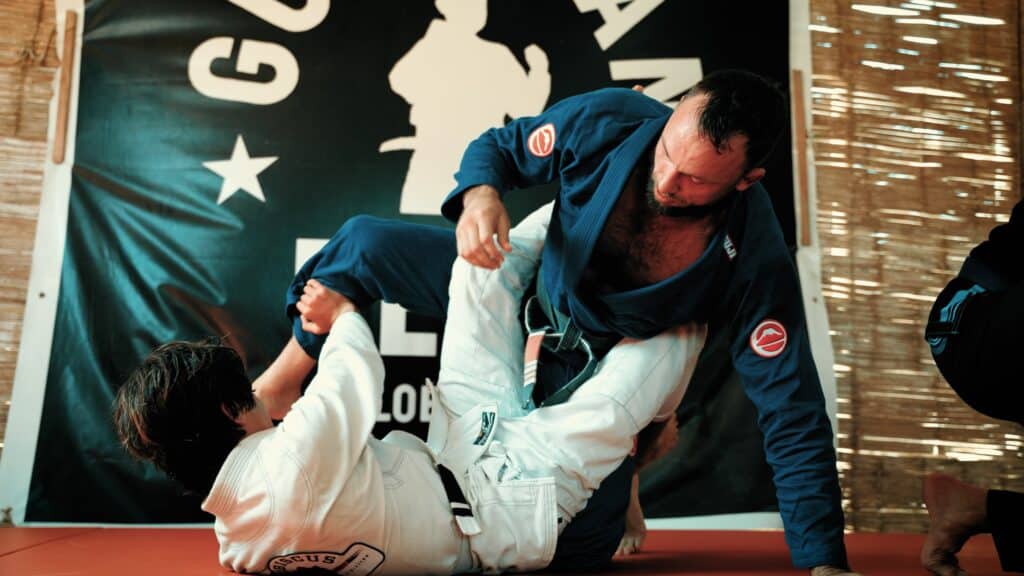 Fair Fight foundation members grappling in gi with kid.