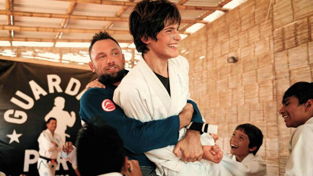 Fair Fight foundation members in gi grappling and laughing